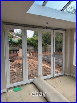 Conservatory set up Bi fold doors, windows, Lantern roof light (Sky light)