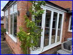 Conservatory set up Bi fold doors, windows, Lantern roof light (Sky light)
